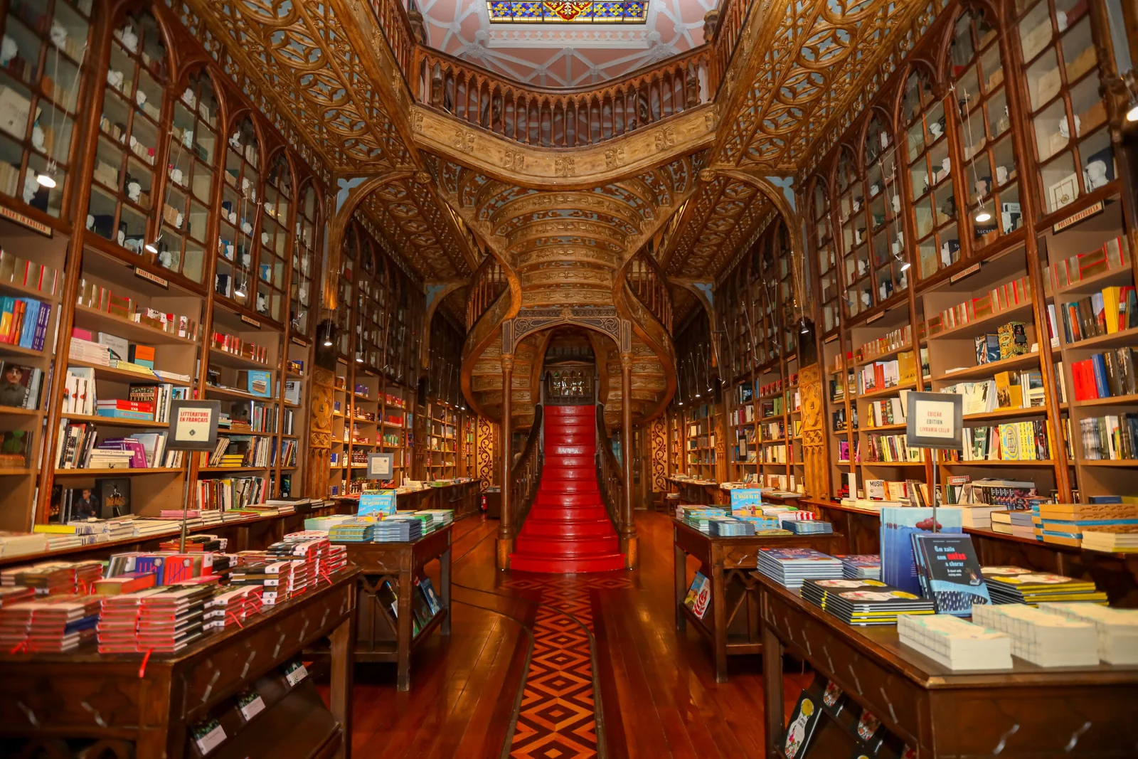 Scenic Porto cityscape featuring historic Livraria Lello bookstore and Douro River, showcasing the lifestyle experience for seniors visiting for dental treatment